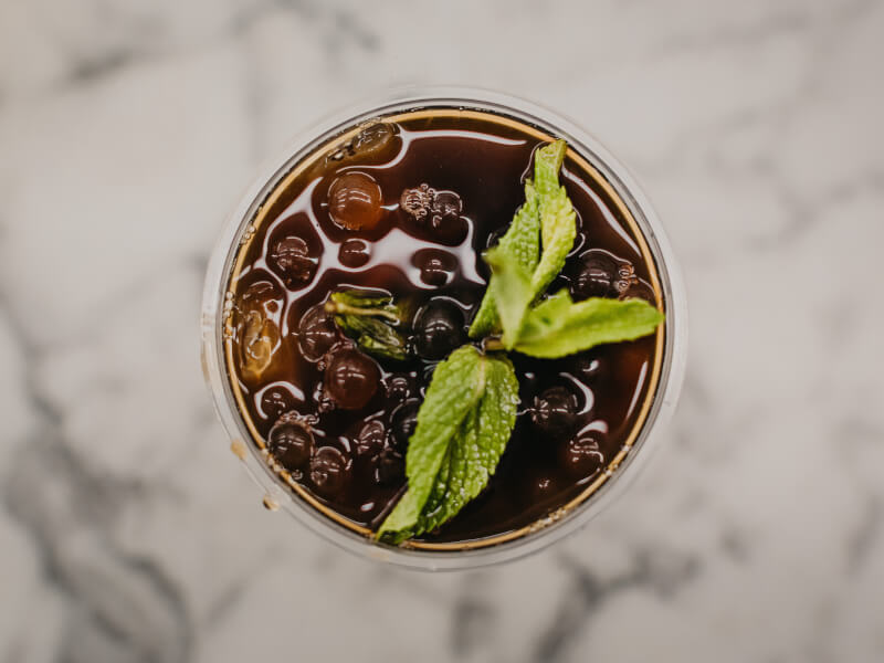 Close up overhead shot of a glass filled with iced tea
